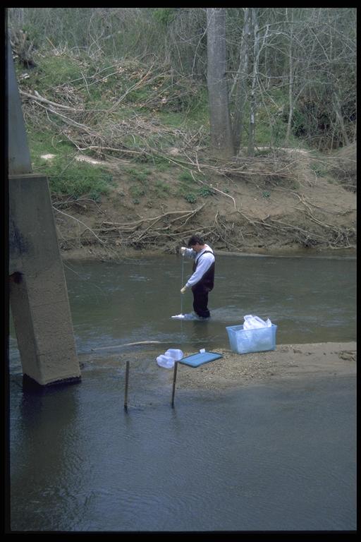 Surface-Water Sample Collection, Robert Thorn sampling surface water.